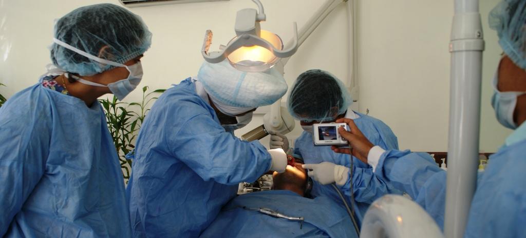 immediate extraction of three teeth and placement of four Nobel active implants